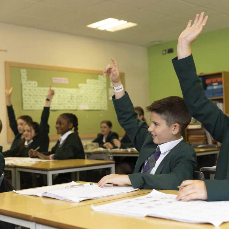 children raising hands