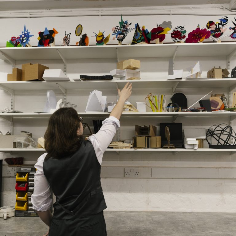 person trying to pick something off a shelf