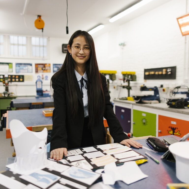 student with her art displays